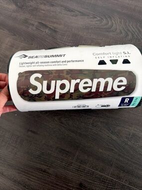 Supreme camo roll-up mat with green and brown tones